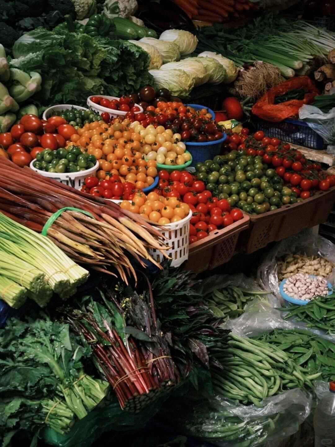 Yunnan Spring Markets — a stall overflowing with spring vegetables
