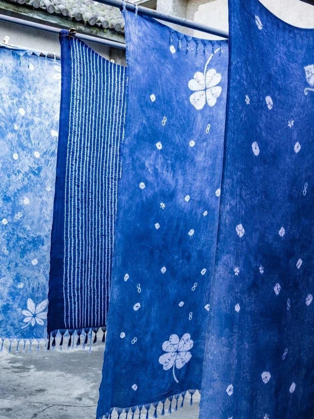 Ethnic Cultures of Yunnan — indigo tie-dye cloth drying in the light