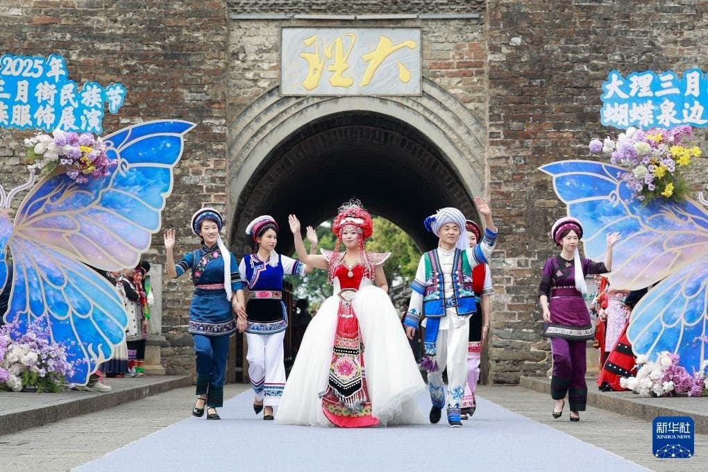 Festivals of Yunnan — performers welcoming visitors to a Bai festival