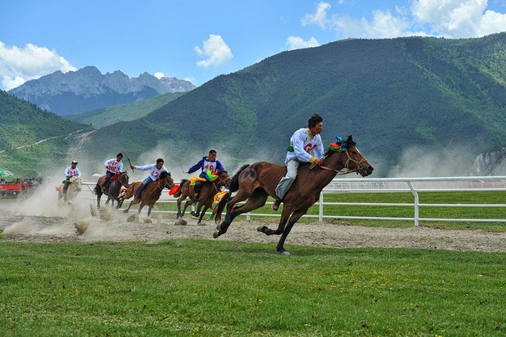 Festivals of Yunnan — horse racing beneath the mountains of Shangri-La