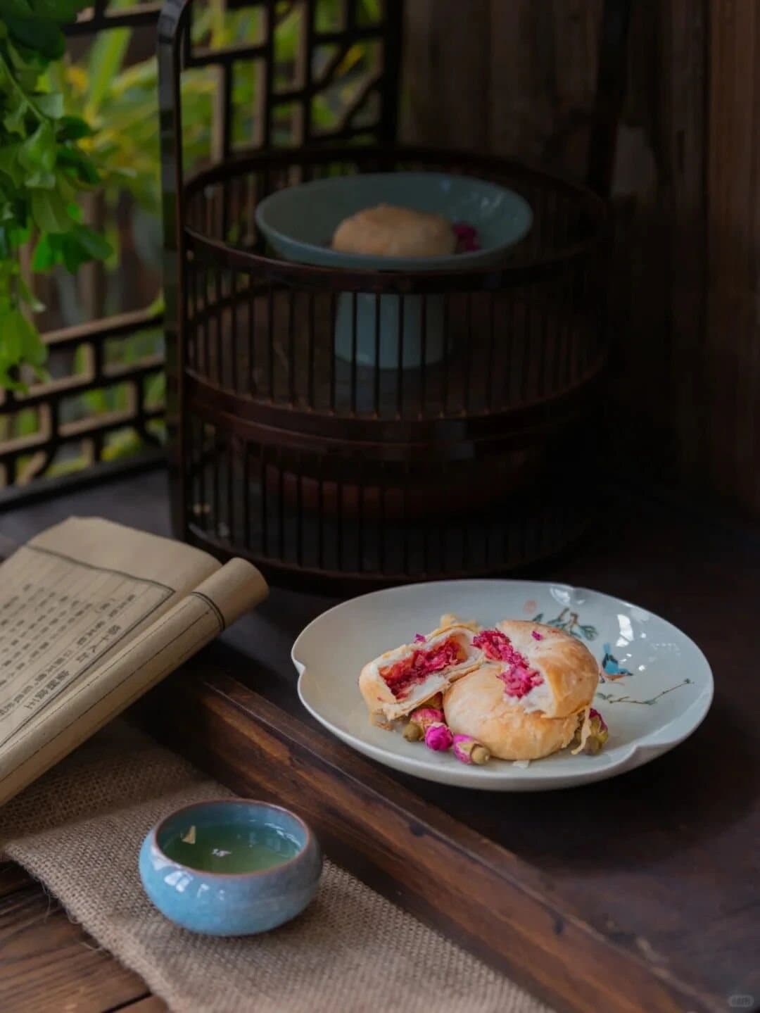 Yunnan Flower Pastry — a rose-topped flower pastry beside tea