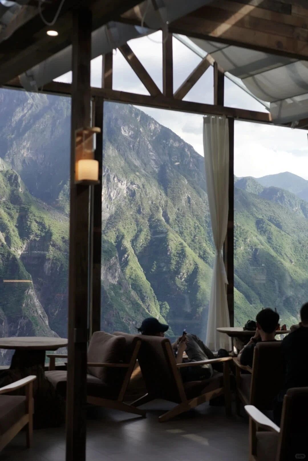 Tiger Leaping Gorge — hikers resting at a mountain viewpoint