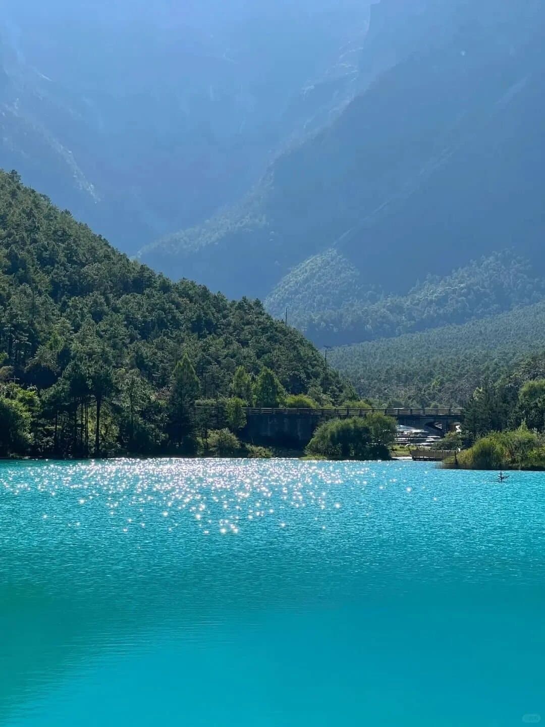 Blue Moon Valley — a blue lake between forested mountains