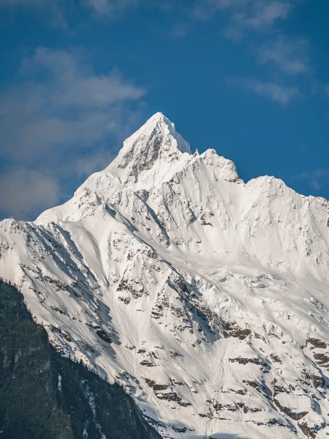 Yubeng Village — a sharp snow summit above Yubeng