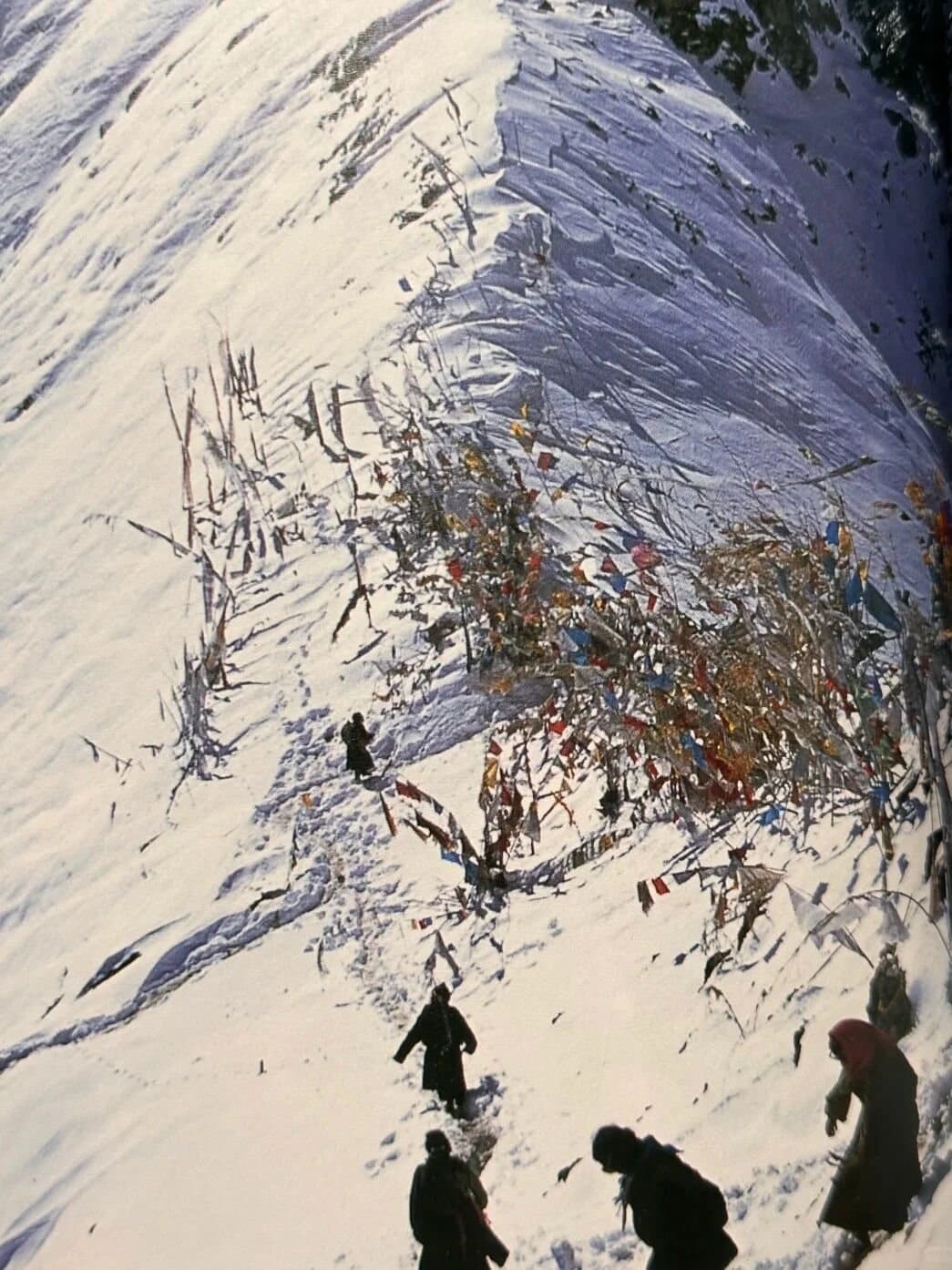 Yubeng Village — hikers climbing a winter mountain path