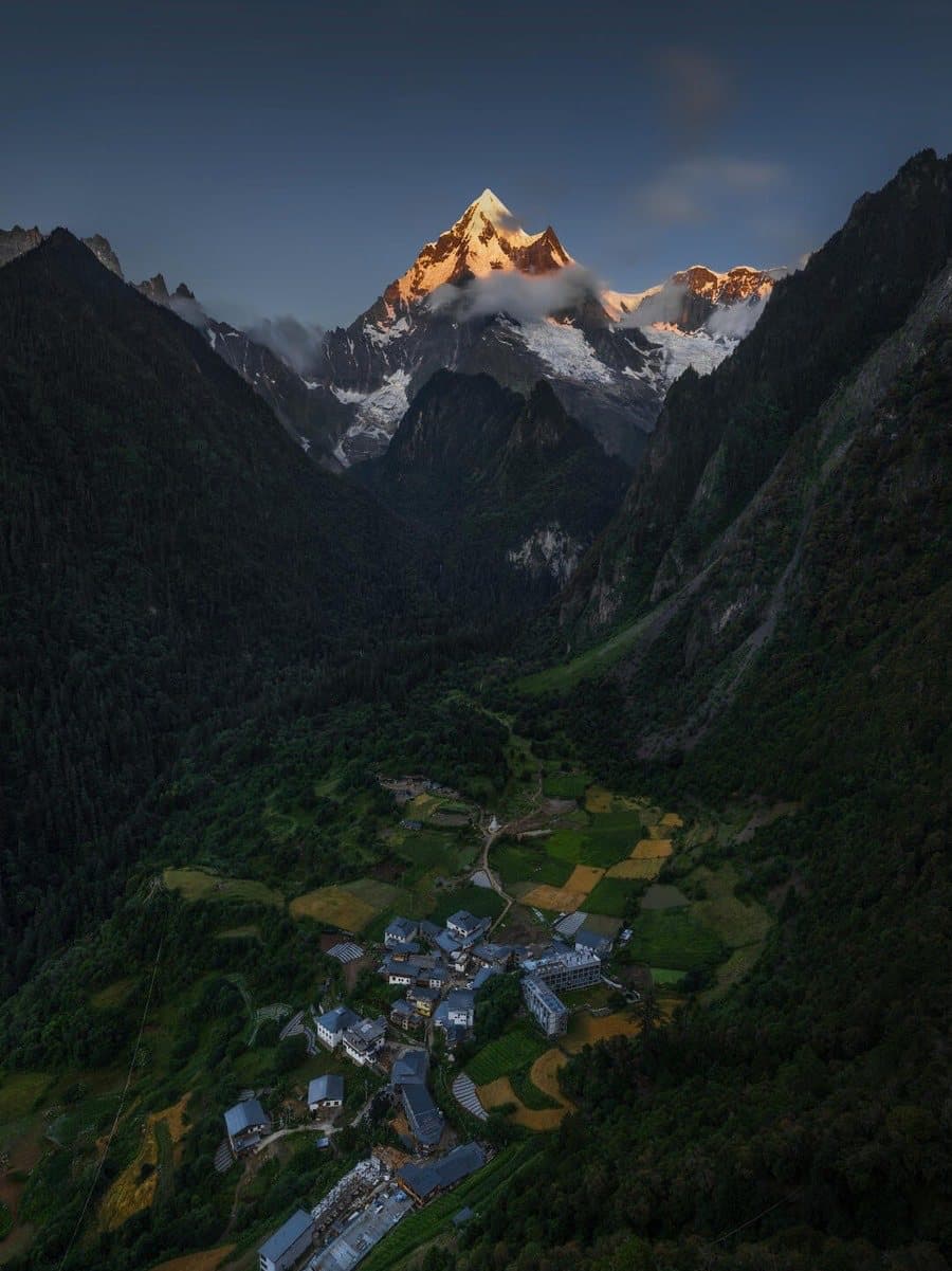 Yubeng Village — evening light on the village and distant peaks