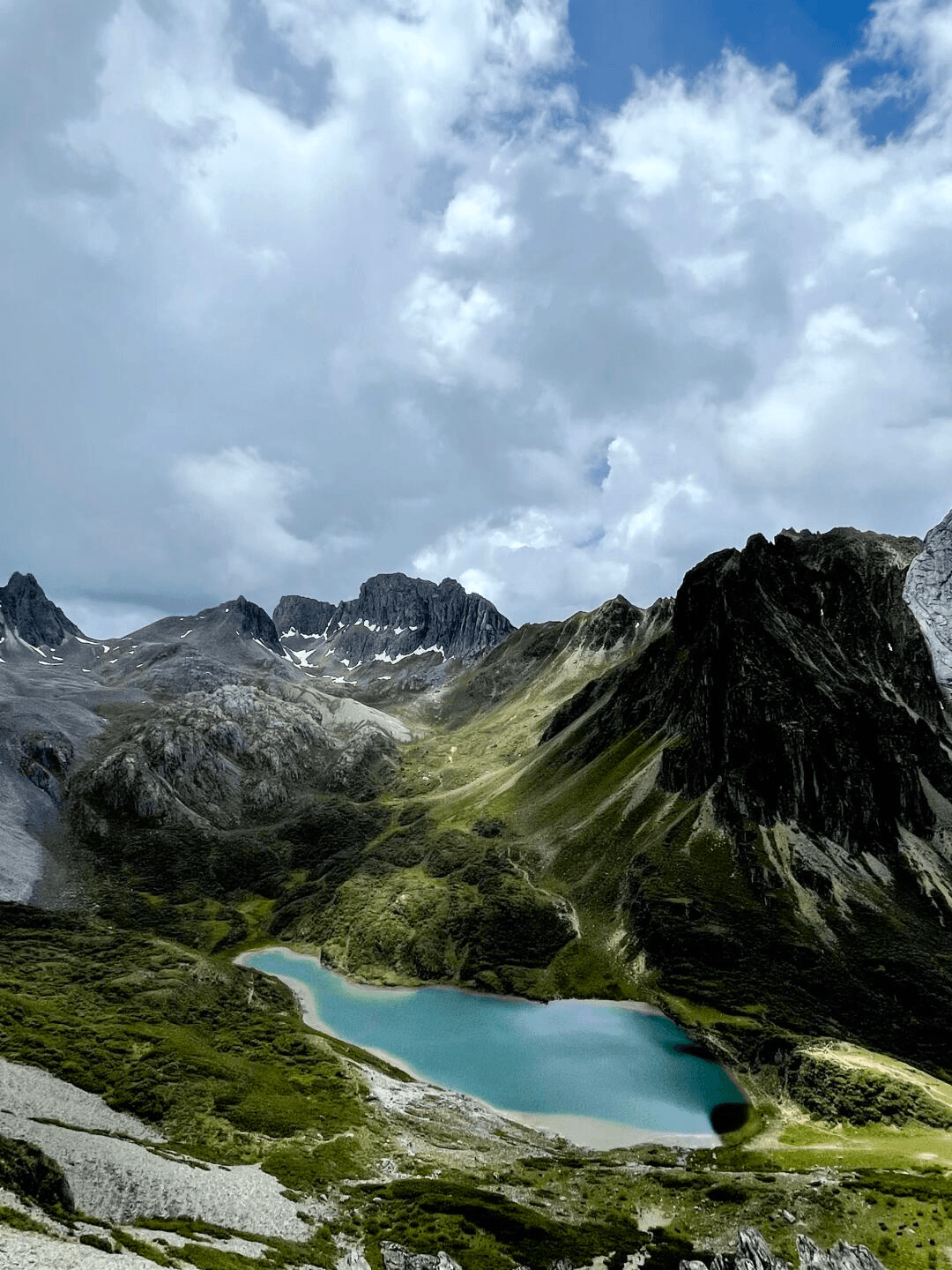 A hiker looking down towards Abuji Lake